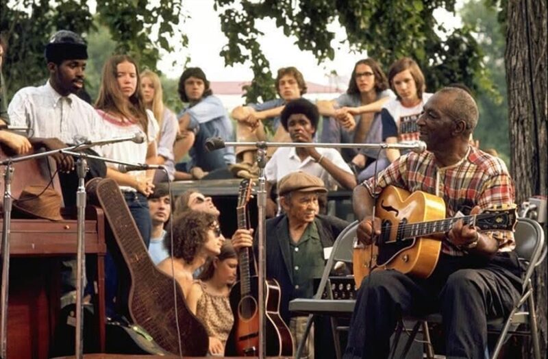 musician and audience outdoors