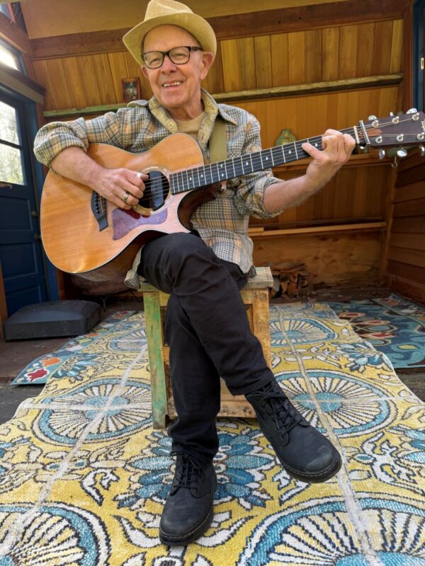 Frank Goodman playing guitar