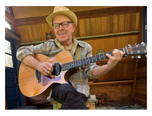 Frank Goodman playing guitar