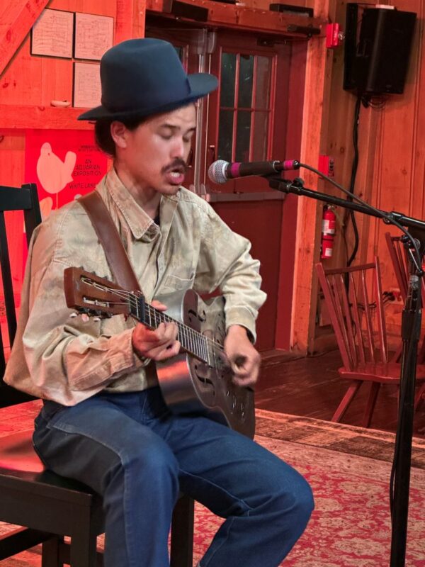 Nat Myers singing and playing guitar